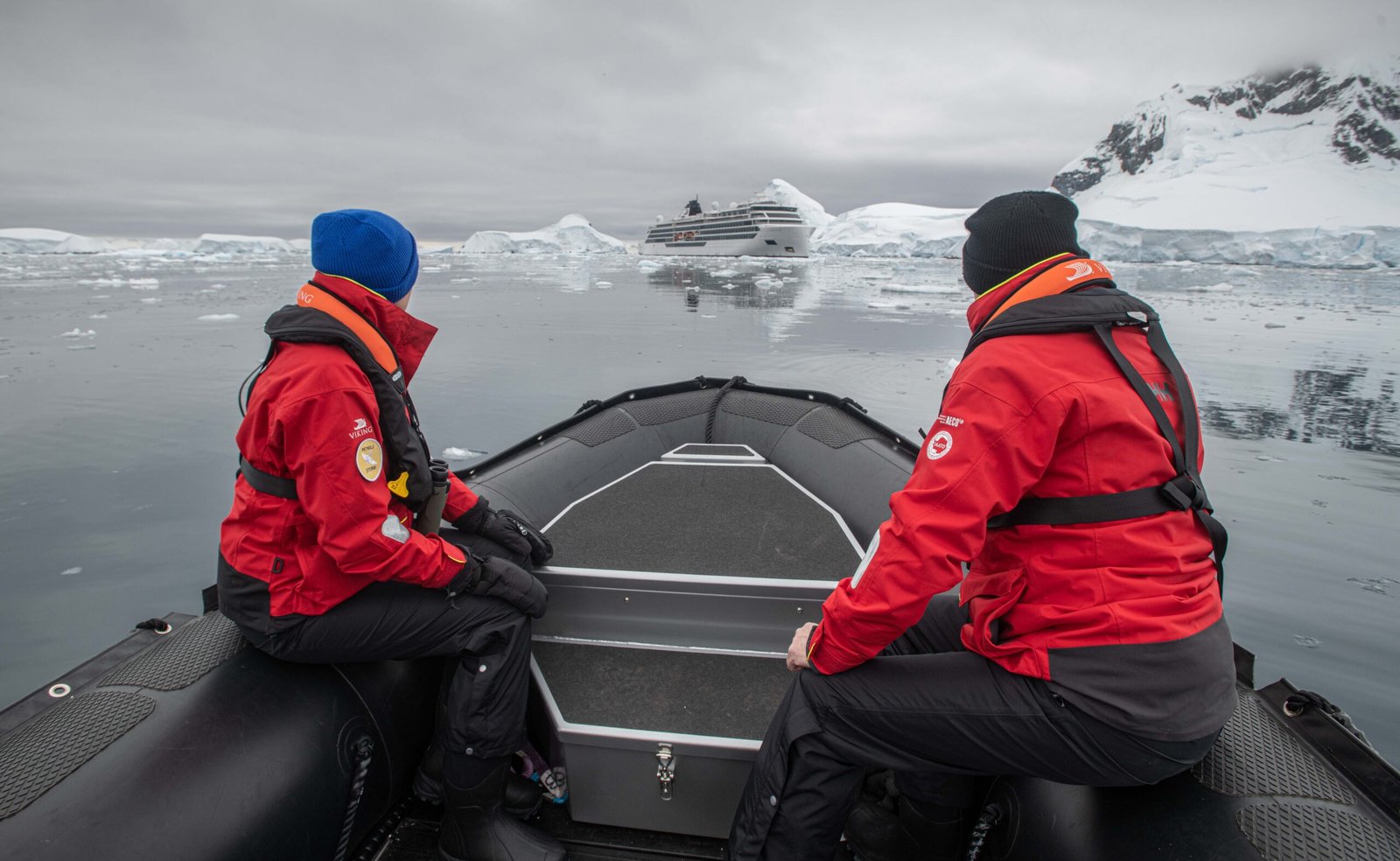 Couple on a zodiac approaching the Viking Octantis in Antarctica.